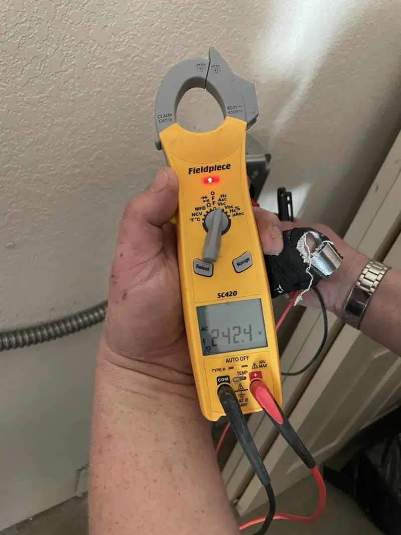 Voltage testing with clamp meter during Generator Installation in Lake Wales